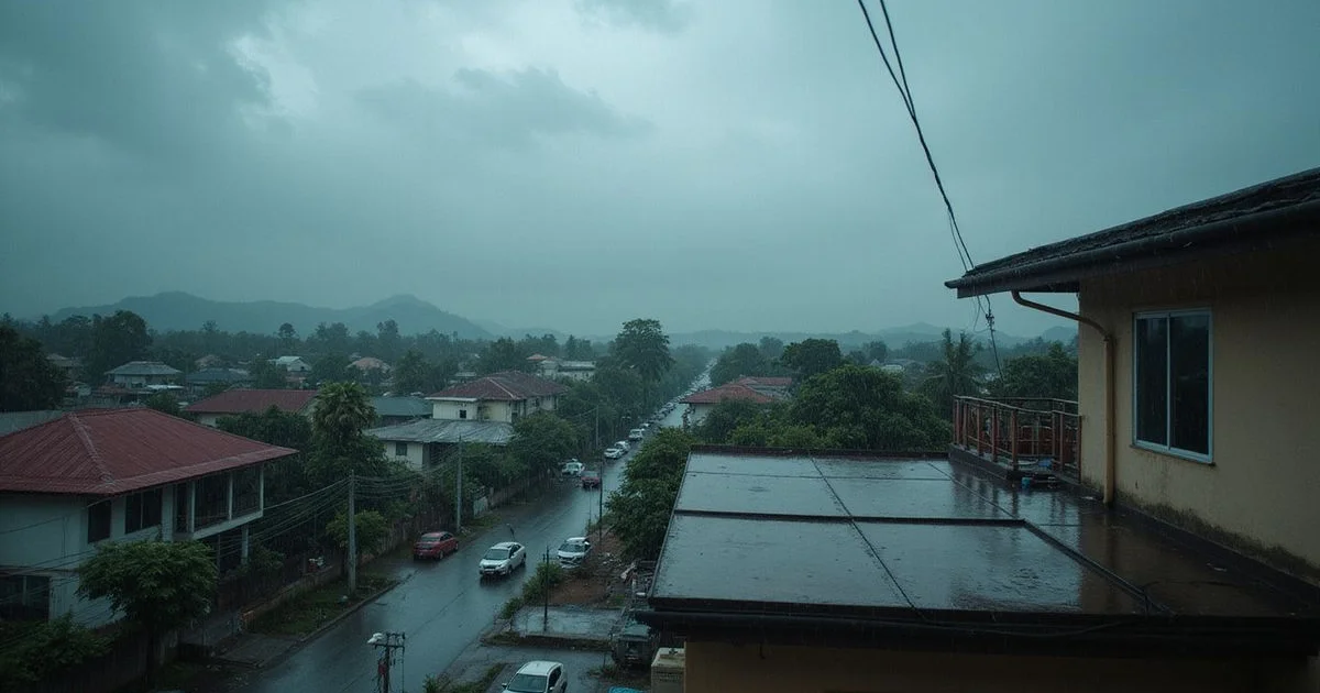 Heavy tropical rain over a Klang Valley residential rooftop